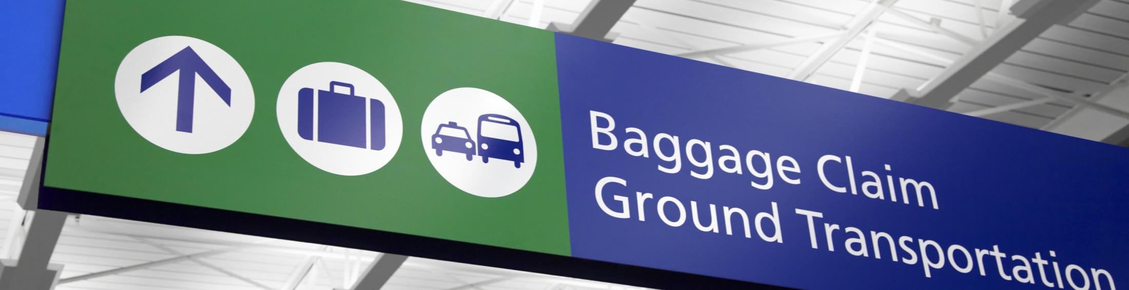 Airport sign that says "baggage claim" and "ground transportation"