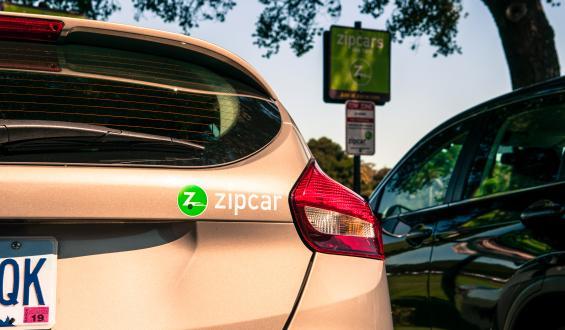 close up of Zipcar sticker on back of car