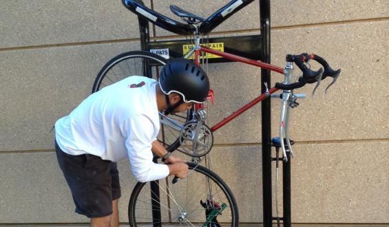 man using bike repair stand