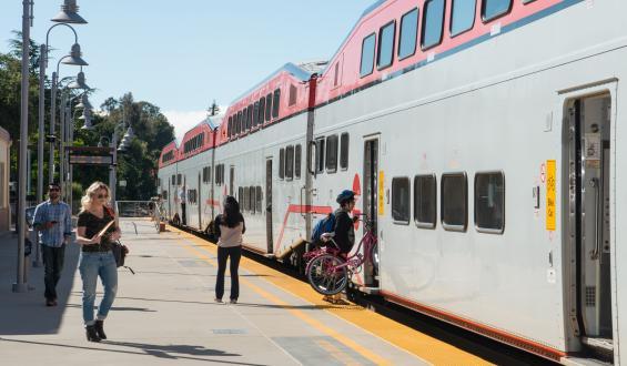 People boarding Caltrain at station